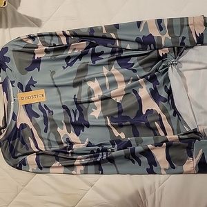 Long-sleeved, medium camo shirt.